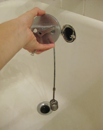 soap coming out of tub overflow cover