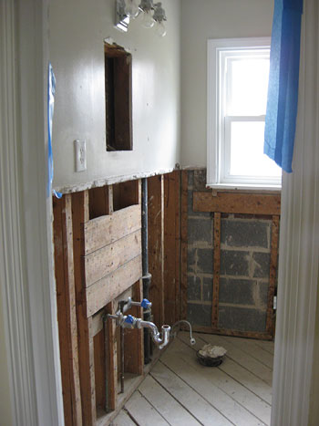 demoing tile, mortar, & metal mesh in the bathroom walls | young