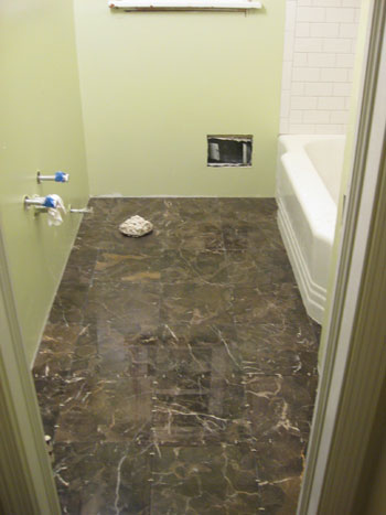 bathroom floor trim baseboards molding install rubber tile young subway renovation marble grout younghouselove