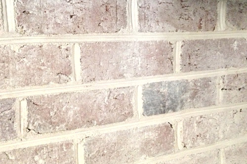Use leftover paint using this DIY whitewash brick technique (how-to video included!) to update a dark or dated brick wall or fireplace.