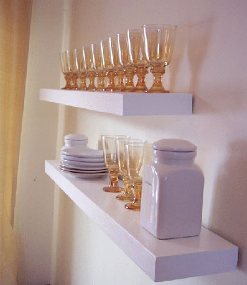 do it yourself floating shelves created by Ana White looking pretty with glassware and plates