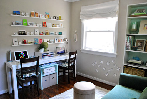 final of colorful office with postcard wall over narrow desk