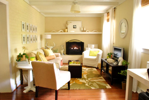 final living room with warm white walls and floral rug