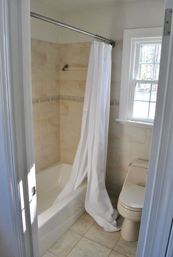 Using a Ceiling Curtain Track to Hang a Shower Curtain