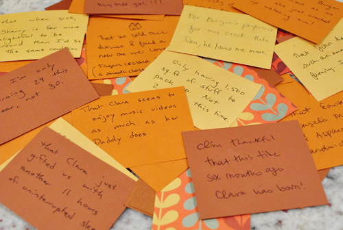 Thanksgiving thankful notes handwritten on fall colored notecard