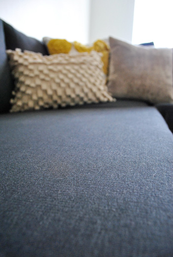 close up detail of ikea sectional sofa fabric in dark sivik gray