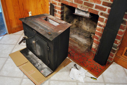 Changing out the fire brick in my country hearth wood stove. 