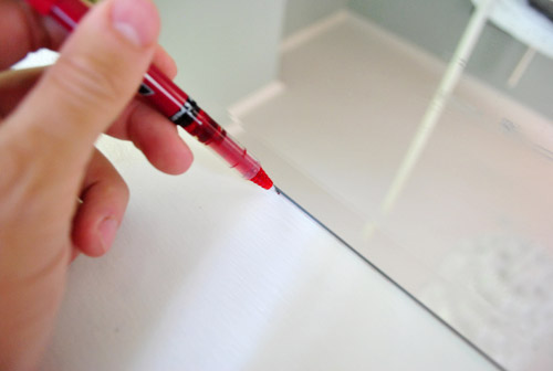 BathDoor Red Pen On Edge