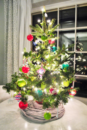 Small Homemade Ornaments On Colorful Tabletop Christmas Tree