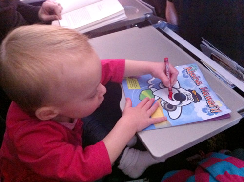 flying with toddler coloring on airplane tray