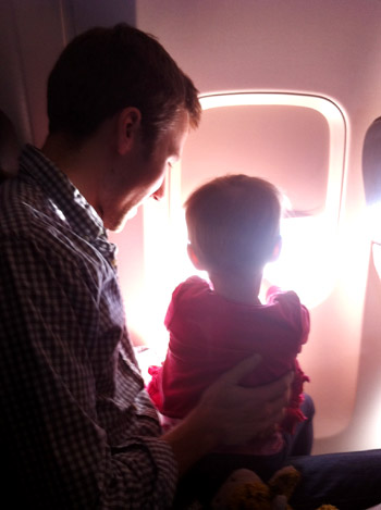 flying with toddler looking out the window