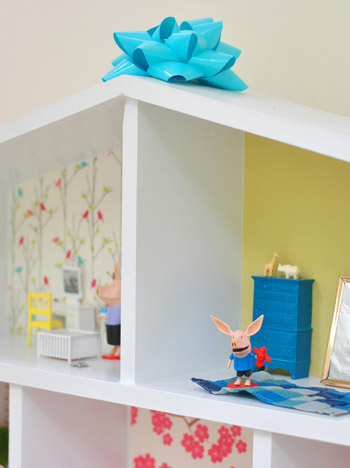 Bow On Top Of DIY Homemade Dollhouse Build For Daughter
