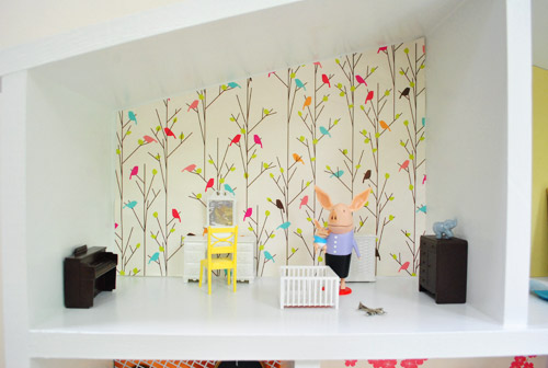 Detail Of Dollhouse Room With Olivia The Pig Dolls And Bird Wallpaper