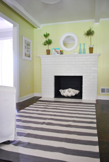 Fireplace cover - child proofing the stone hearth Gray and white stripes  and Chevron print pillows Ho…