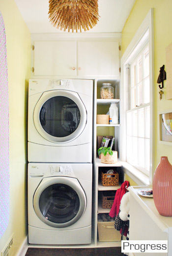 After Of Laundry Room With Stacked Washer And Dryer With Green yellow Walls and Built In Shelves