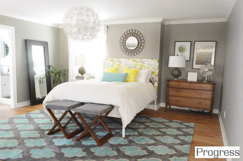 After Of Bedroom With Geometric Diamond Rug And Gray Walls