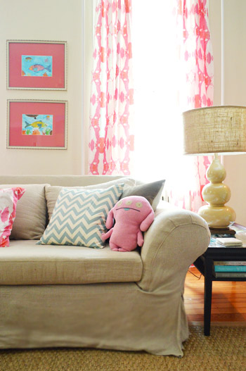 Farmhouse Decor With Pink Curtains And Colorful Pillows