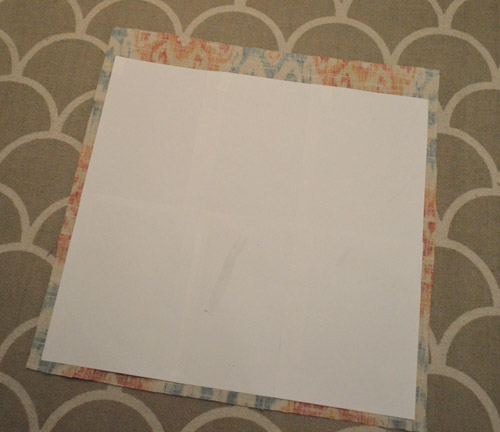 paper template laid overtop fabric