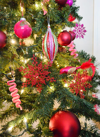 Detail Of Red and Purple Ornaments On Gradient Christmas Tree Design