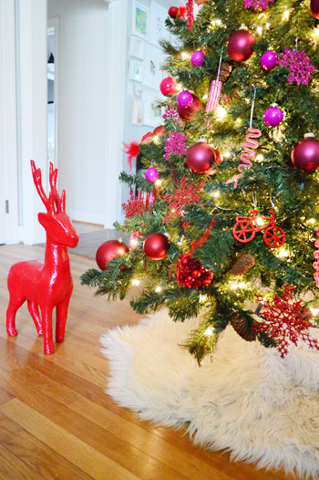 Red Reindeer Decoration At Bottom Of Gradient Christmas Tree