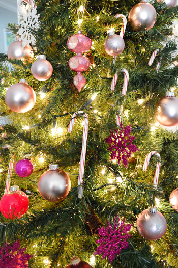Close UP On Pink And Red Ornaments And Candy Canes On Gradient Christmas Tree