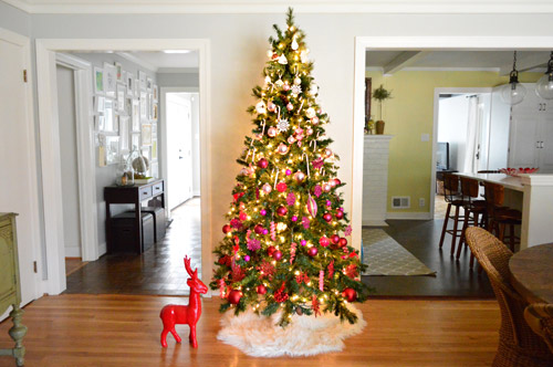 Far View Of Gradient Christmas Tree Sitting Between Hallway And Kitchen