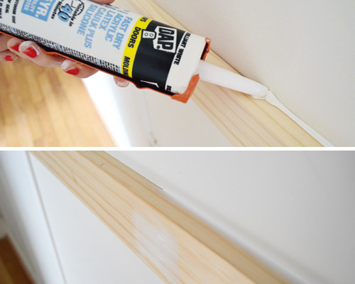 using DAP caulk in caulk gun to fill seams in do it yourself wood molding installation project