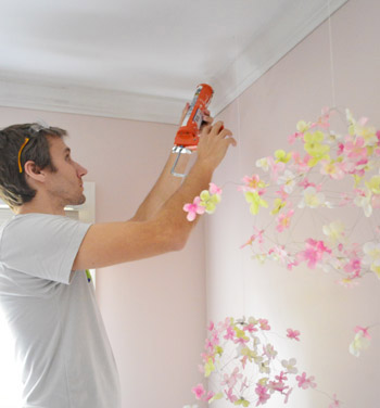 John adding caulk against ceiling where crown molding has slight gap