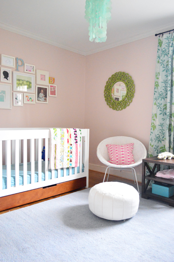 girl's bedroom with pink walls blue carpet and crown molding installed