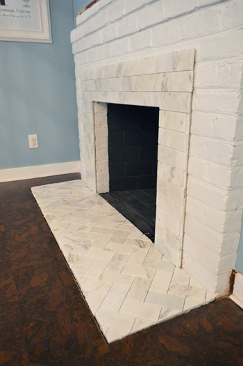 Fireplace Makeover Tiling The Mantel With Marble Herringbone