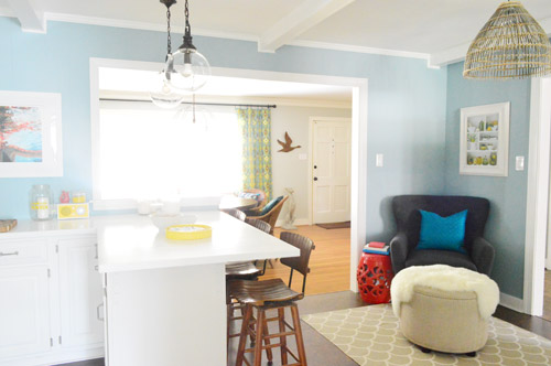 After Photo Of Kitchen With Wall Opened To Dining Area In Front Of House With Blue Walls