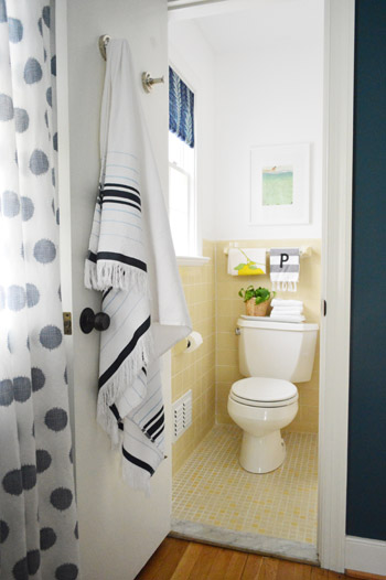 After Photo Of Guest Bathroom From Within Bedroom With Dark Blue Walls And Curtains