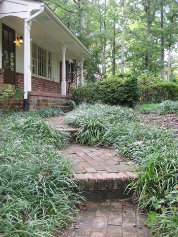 Before Photo Of Brick Pathway With Traditional Columns On Front Porch
