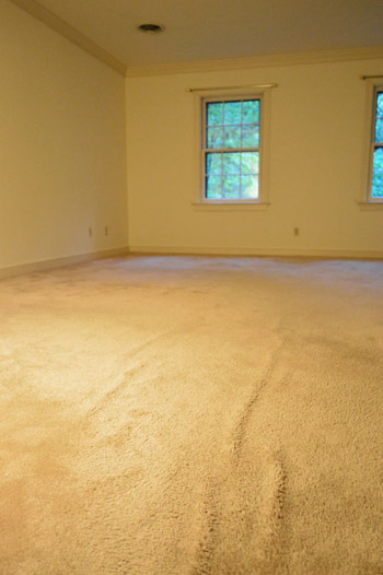 old wrinkled carpet in bedroom