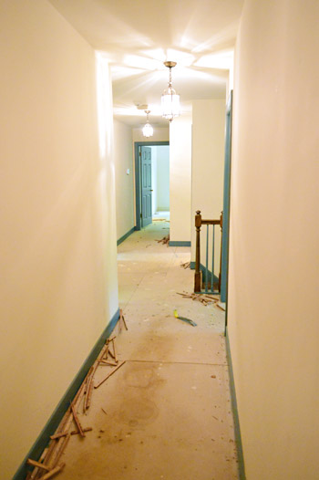 subfloor in hallway with carpet removed