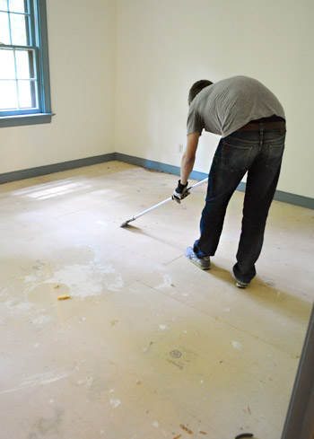 using scraper bar to remove carpet staples