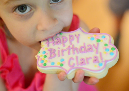 Girl Eating Special Birthday Cookie