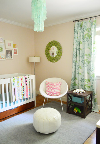 After Photo Of Nursery With Pink Walls and Green and Blue Curtains