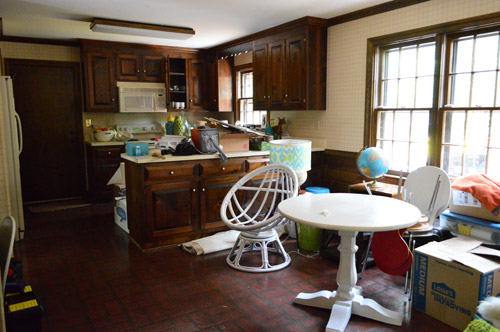 Dated Kitchen Cluttered With Items From Moving In