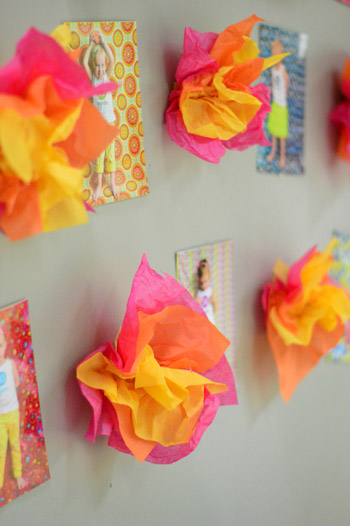 Tissue paper Fire Puffs Among Photo Display On Wall