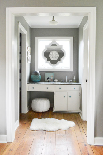 After Photo Of Bedroom Sink Nook With Quatrefoil Mirror In Window Over Vanity