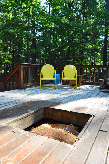 Hole in wooden deck left by removed tree