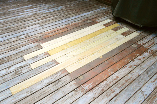 Patched hole in wooden deck