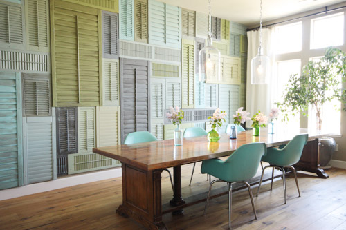 Dining Room With Accent Wall of Large Colorful Shutters