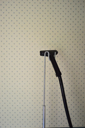 Clothes steamer to remove outlet wallpaper