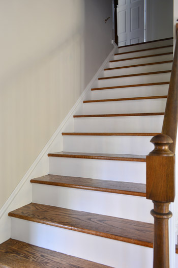 stair riser painted white on wooden staircase