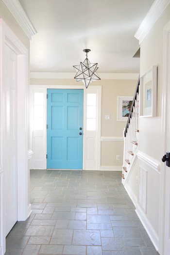 Foyer with blue door and gray ceiling Revere Pewter Benjamin Moore and greige walls Edgecomb Gray