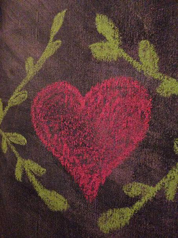 Chalkboard drawn heart with leaf garland around it