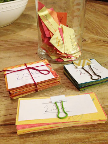 Gratitude notes for Thanksgiving saved in binder clips over multiple years