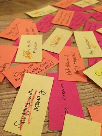 Thanksgiving Thanks Jar gratitude notes spread out on table as part of holiday craft tradition